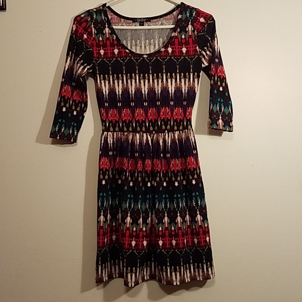 Multi color dress with quarter length sleeves.